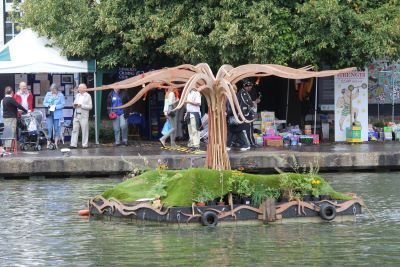 A floating green mock tropical island on the water