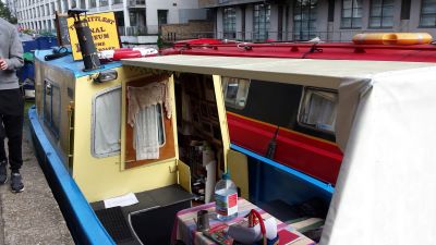 A table of refreshments on a boat with a roof over