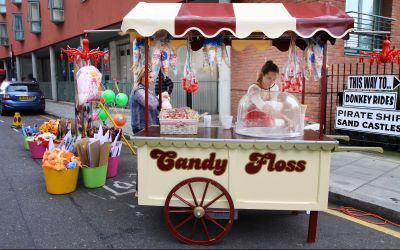 Wheeled candy floss stall, yellow with large wheel