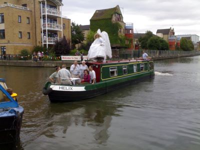 A human angel on top of a boat