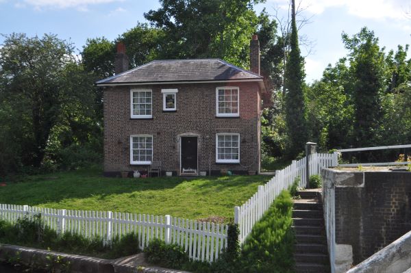 Elegant two-story house beside lock