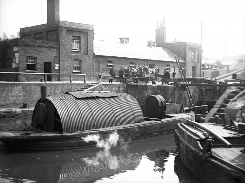 Workboats with buildings in the background