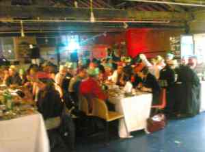 Christmas dinner - guests seated at long tables